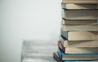 assorted books on wooden table