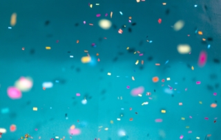 selective focus photography of multicolored confetti lot