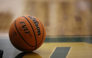 a close up of a basketball on a basketball court