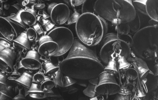 grayscale photo of bells
