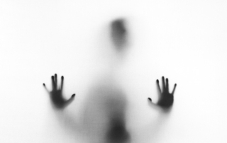 person behind fog glass